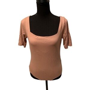 About Jai Body Bodysuit Nude Large NWT